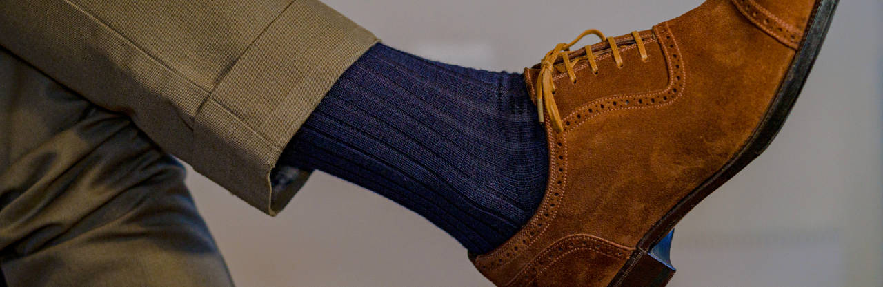 close up photo of high quality navy blue dress socks for men