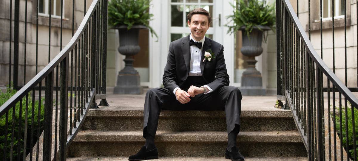 groom wearing black wedding dress socks