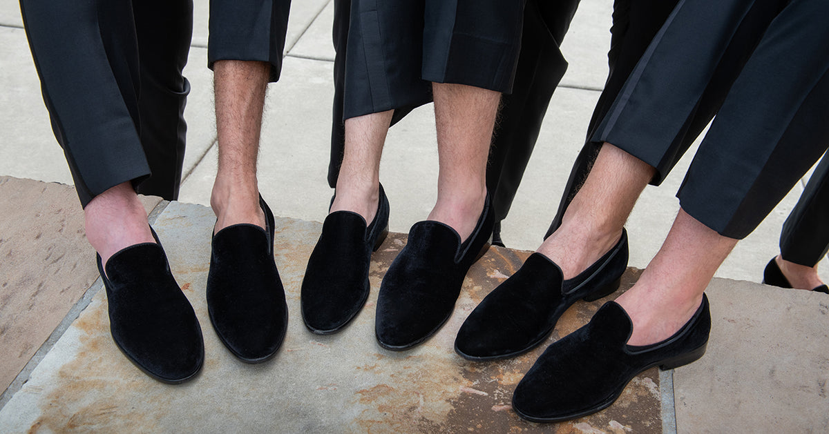 groomsmen wearing tuxedos with no socks
