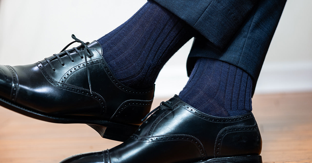 navy wool dress socks with dark slacks and black oxfords for male banker