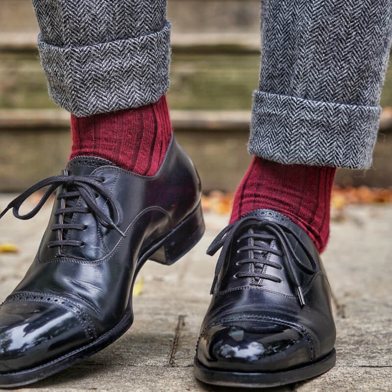 burgundy dress socks with herringbone trousers and black captoe dress shoes