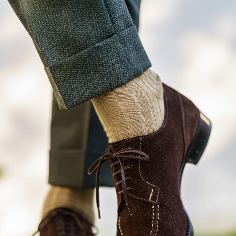 men's khaki wool dress socks paired with olive trousers and brown dress shoes