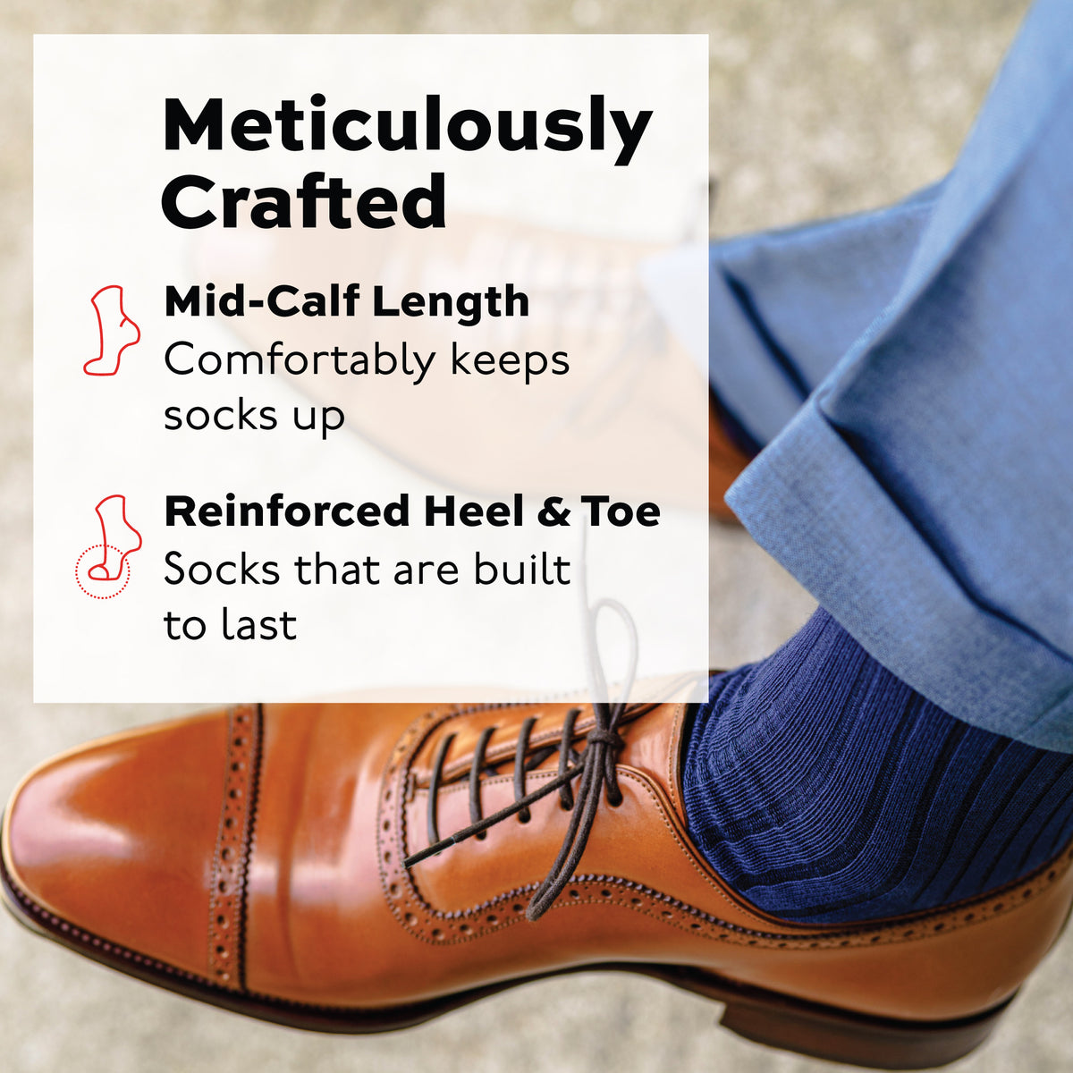 close up image of man crossing his legs wearing Navy Cotton Mid Calf Dress Socks with brown shoes and grey slacks