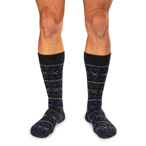 man wearing black and purple Fair Isle patterned men's socks