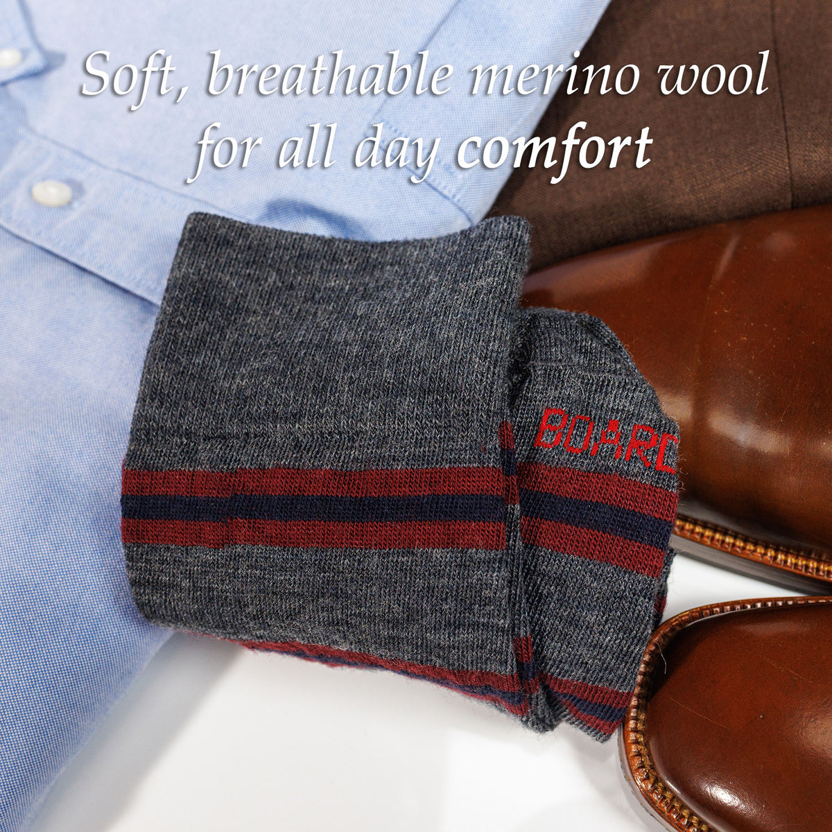 pair of grey heather striped wool dress socks atop business casual outfit