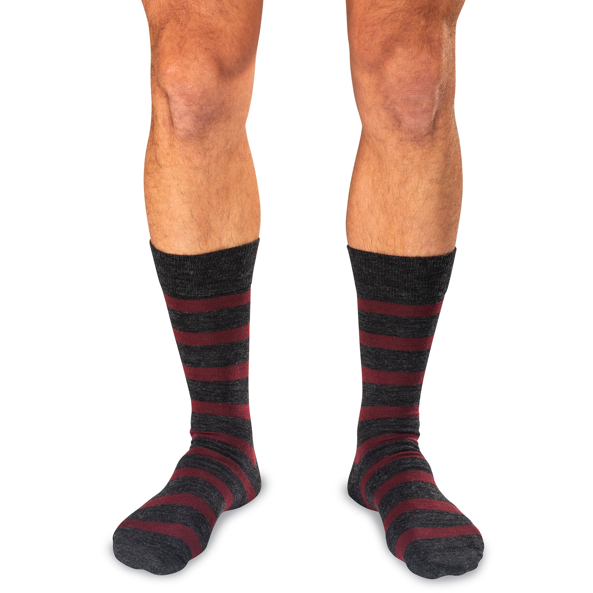 model wearing mid-calf length striped burgundy and charcoal grey dress socks