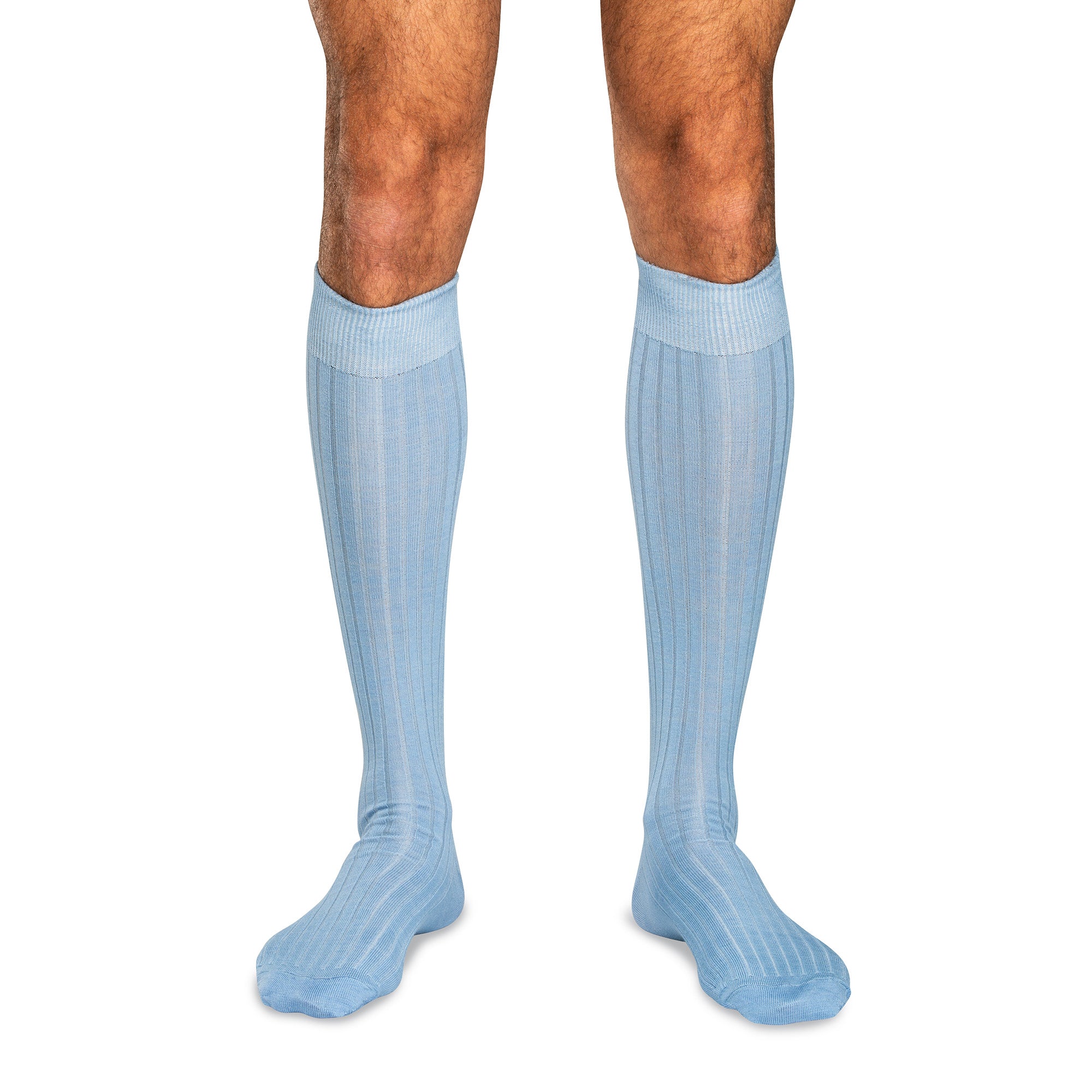 model wearing light blue wool over the calf dress socks