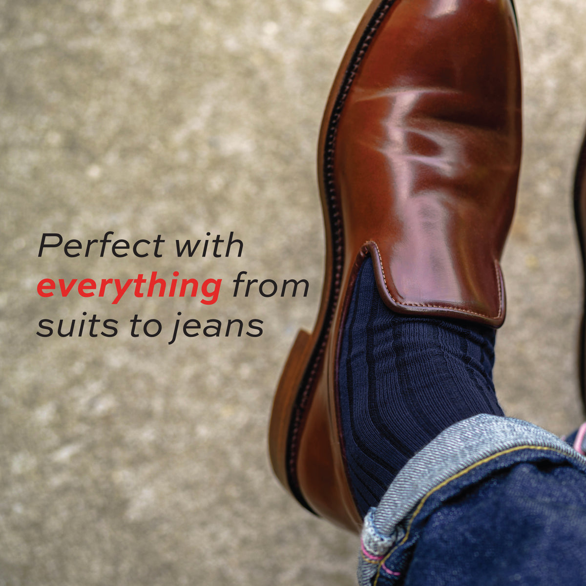 close up image of man wearing jeans and Navy Cotton Over the Calf Dress Socks with a text overlay