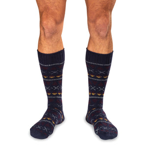 model wearing navy blue Fair Isle patterned merino wool socks