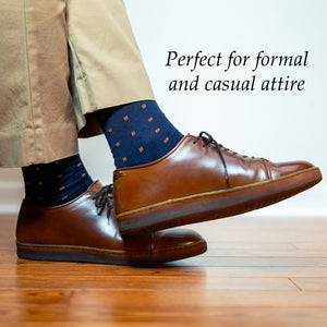 navy and orange patterned dress socks worn with brown dress sneakers and khakis