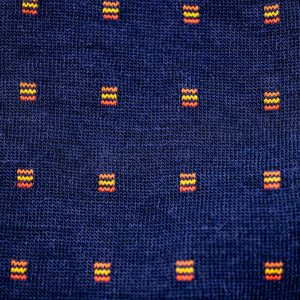 photo showing detail and texture on a pair of navy and orange merino wool dress socks