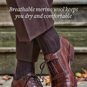 brown dress socks paired with brown dress pants and brown brogue captoe dress shoes for men