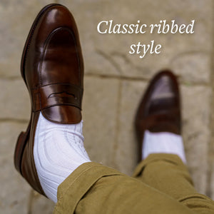 white over the calf ribbed dress socks with khaki chinos and brown penny loafers