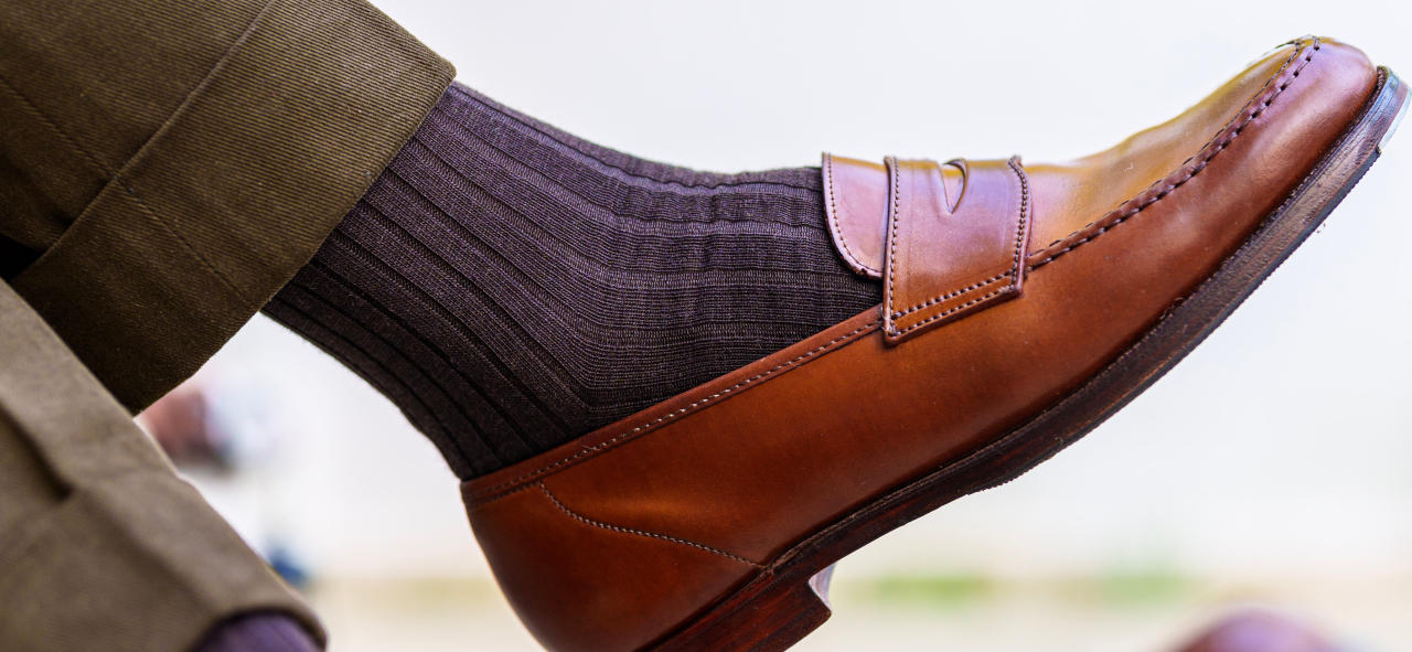 brown socks with a brown suit and brown penny loafers