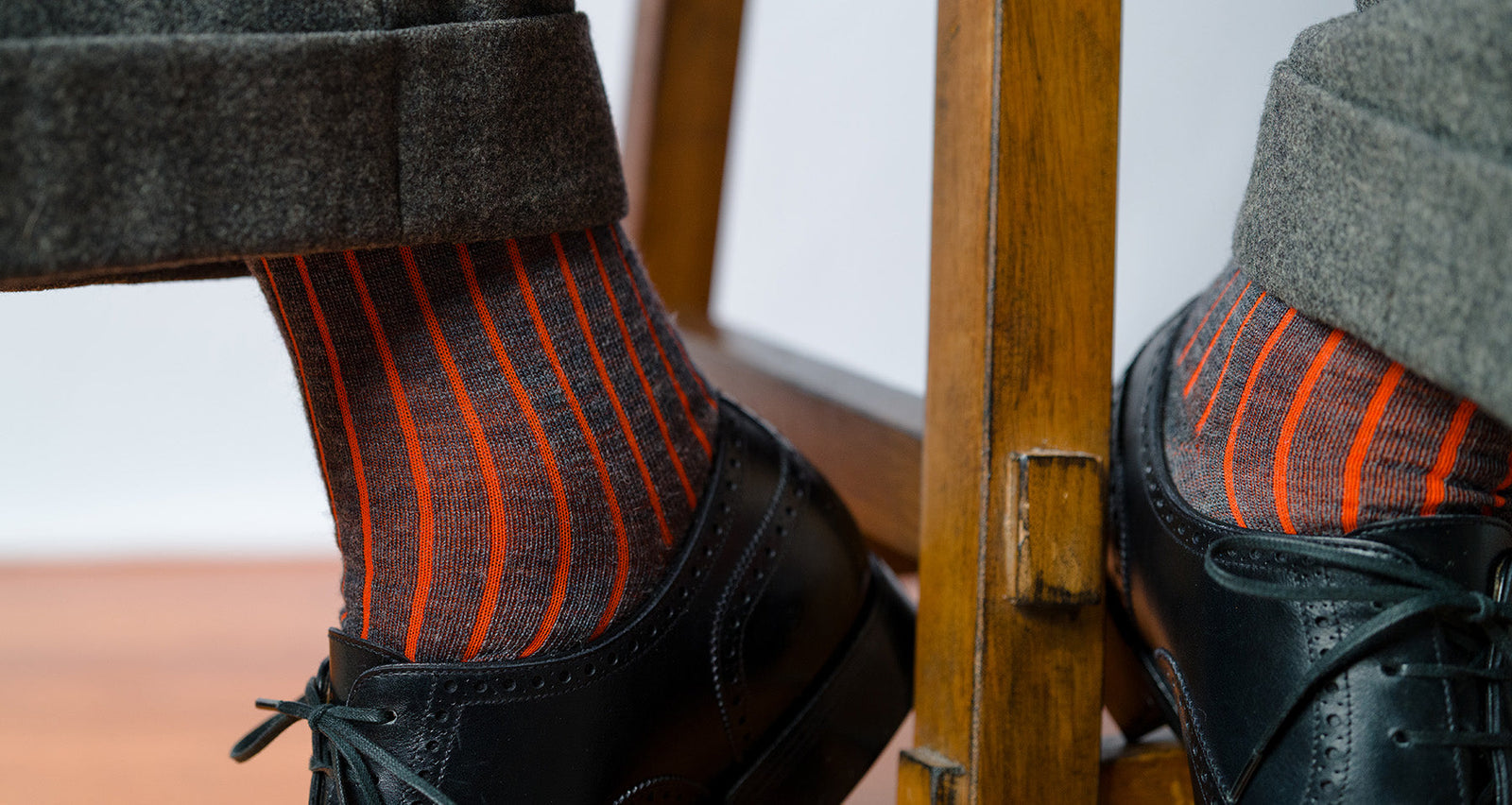 grey heather and orange shadow stripe dress socks worn with grey slacks and black oxfords