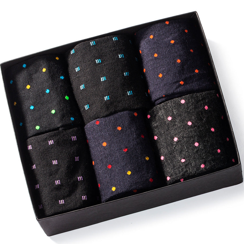 gift box filled with six pairs of merino wool patterned dress socks for men
