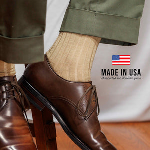 khaki merino wool ribbed dress socks worn with green slacks and made in usa text overlay