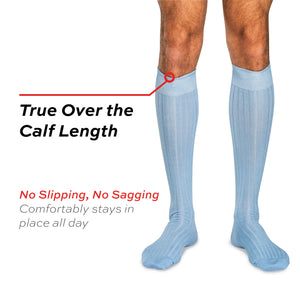 model wearing sky blue merino wool over the calf ribbed mens dress socks on white background