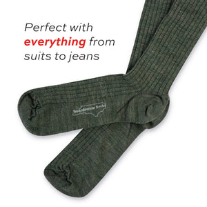 a pair of olive merino wool over the calf ribbed mens dress socks laid flat on a white background