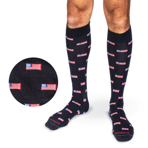 model standing wearing over the calf american flags on navy wool dress socks