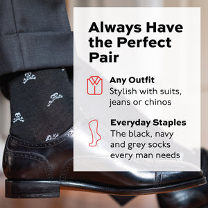 image of person wearing merino wool dress socks with a skull and bones pattern and nice dress shoes