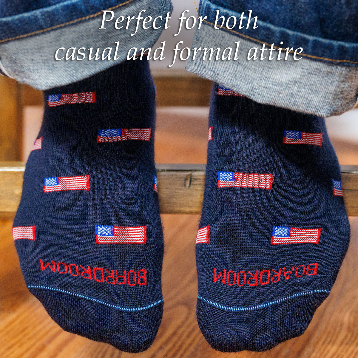 Navy dress socks with American flag design and &#39;BOARDROOM&#39; text worn by a person.