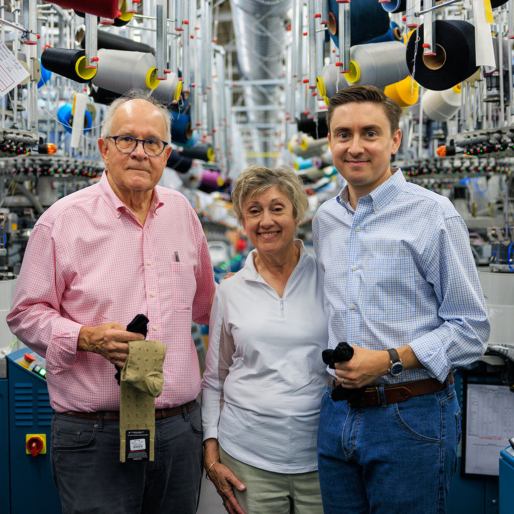 James family of Boardroom Socks standing in knitting mill