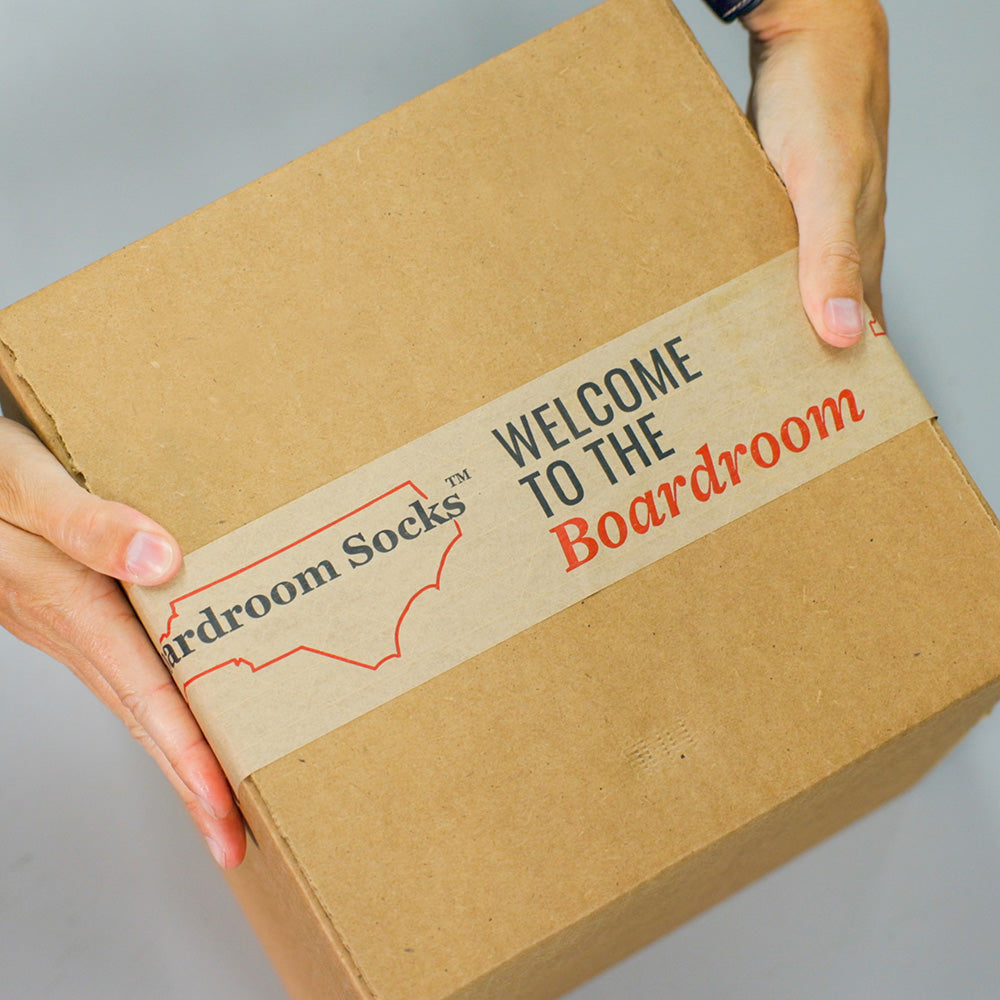 corrugated box filled with dress socks sealed with Boardroom Socks tape