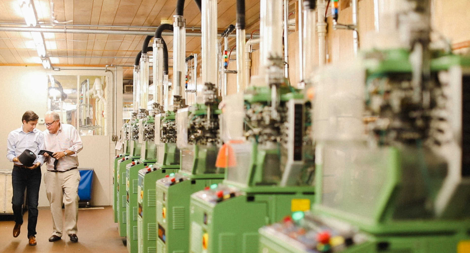 mike and nathan james walking through boardroom socks hosiery mill