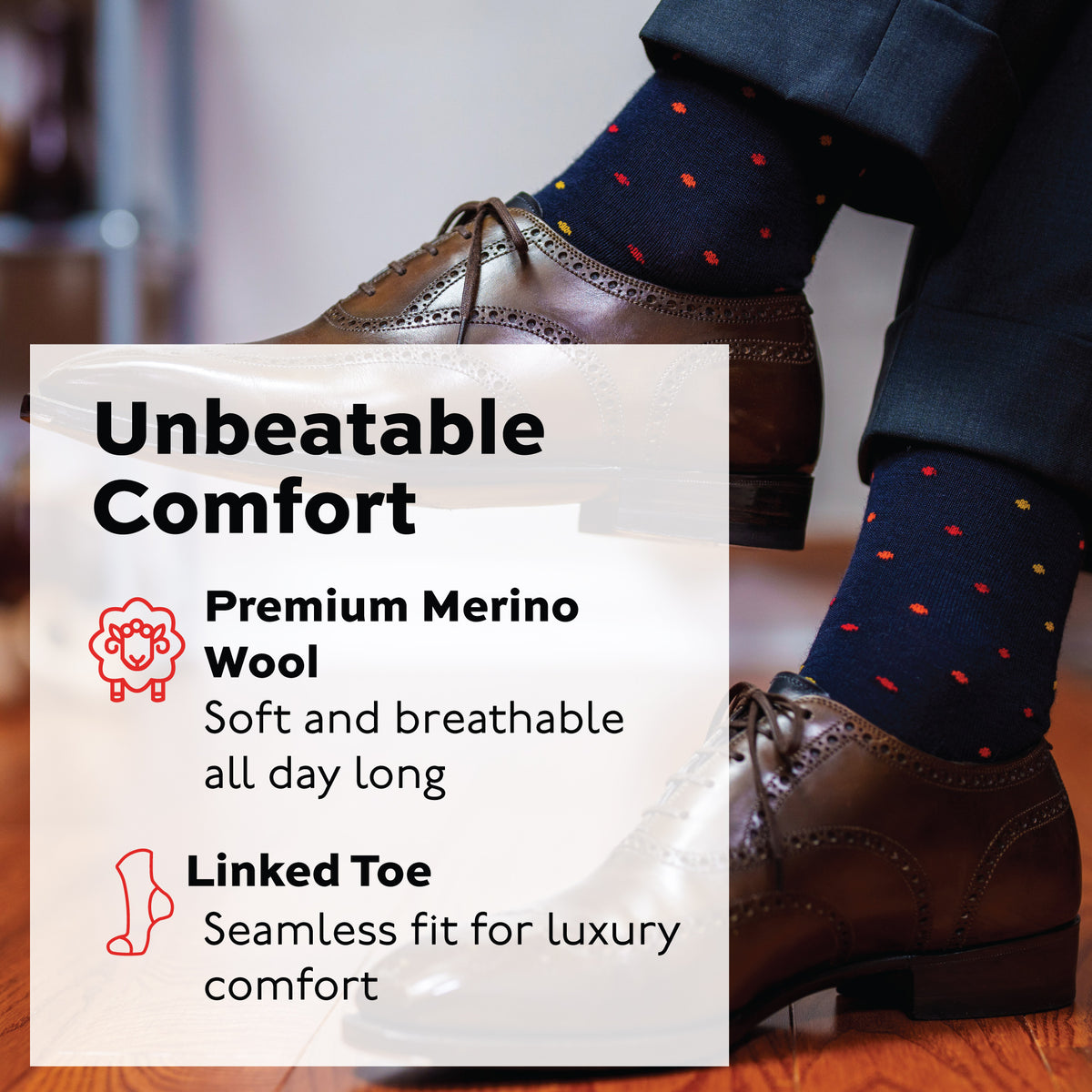 man crossing legs wearing over the calf merino wool navy socks with a tri-color dot pattern and "unbeatable comfort" text overlay