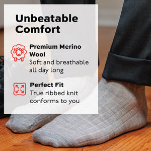 man standing on hardwood floors wearing light grey ribbed wool over the calf socks with an infographic overlay