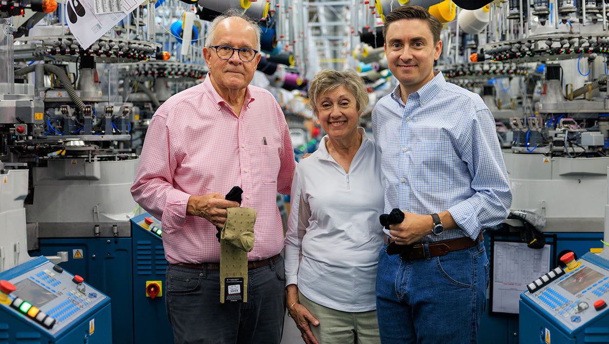 James family of Boardroom Socks standing in knitting mill