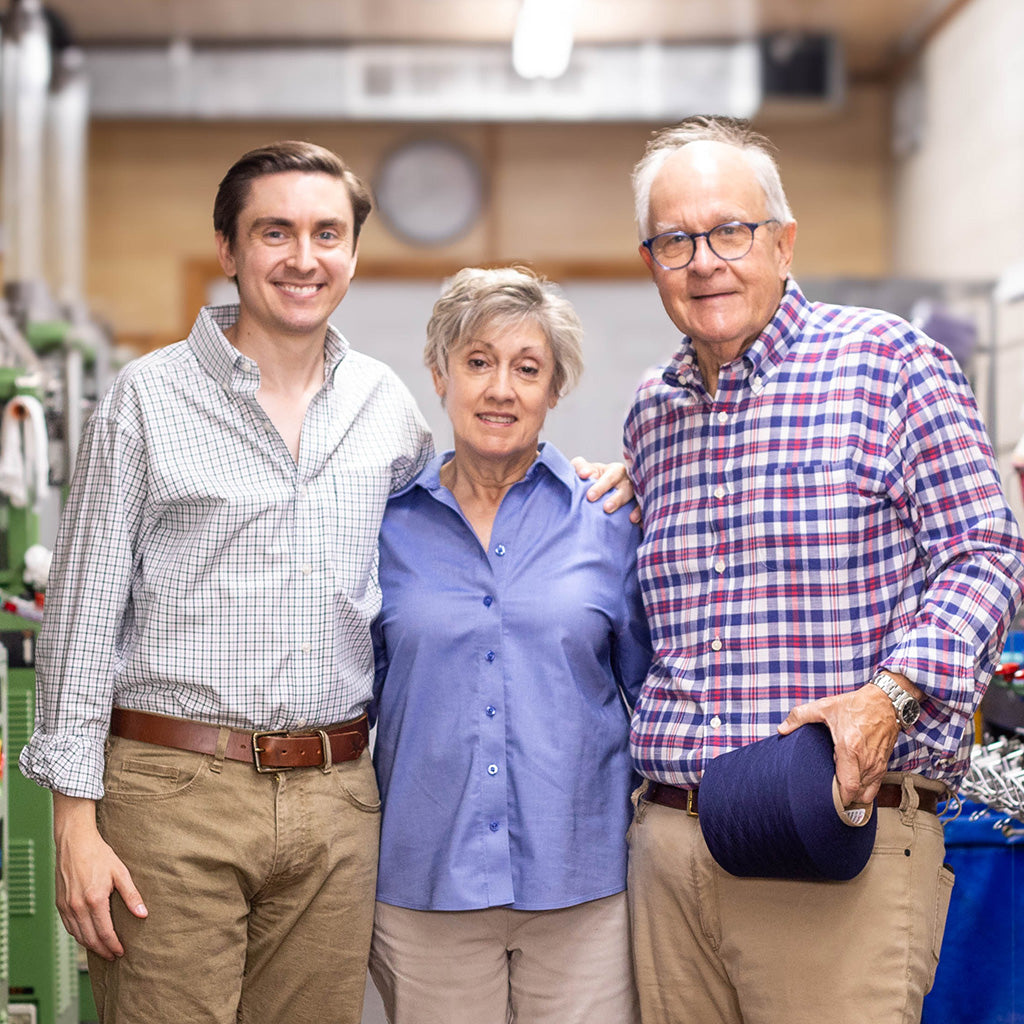 James family from Boardroom Socks standing in knitting mill