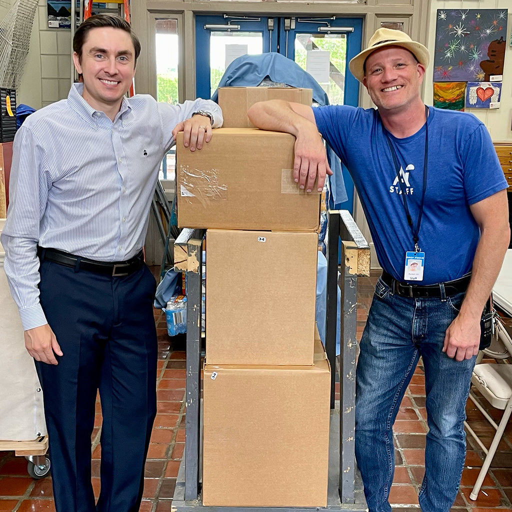 Nathan and Randall at Roof Above shelter with donated socks