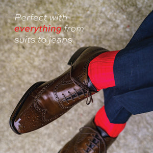 red merino wool dress socks being worn with brown dress socks and navy slacks with a text overlay