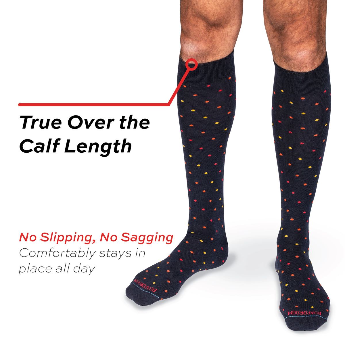 true over the calf length dress socks in navy with tri-color dots worn on model with "no slipping, no sagging" text overlay