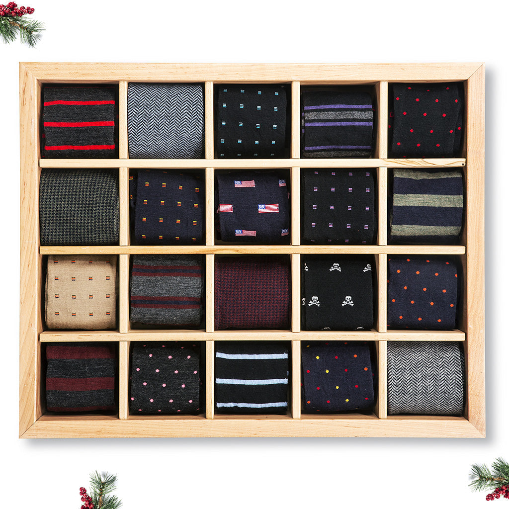 wooden display box showing twenty different patterned dress socks from Boardroom Socks