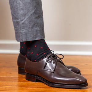 black and red cotton patterned dress socks with light grey slacks and dark brown dress shoes