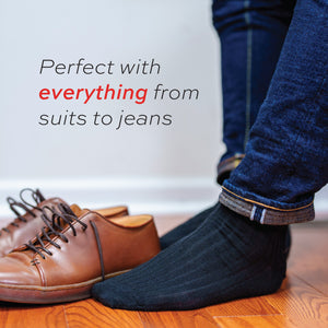 man wearing jeans and black merino over the calf dress socks with perfect with everything text overlay