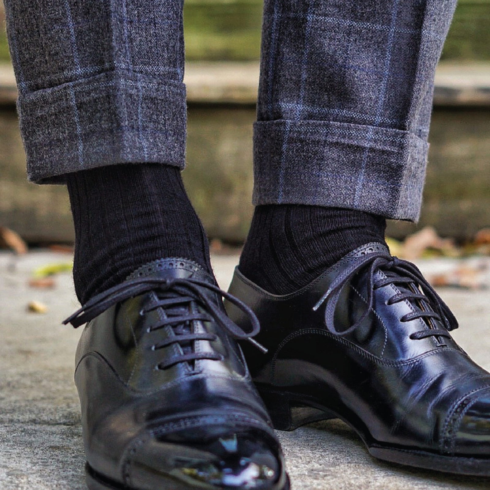 man wearing over the calf mens black dress socks with grey slacks and black shoes