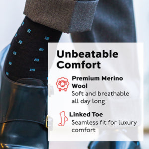 left foot of person wearing blue Square Knots on Black Merino Wool Over the Calf Dress Socks with dress shoes