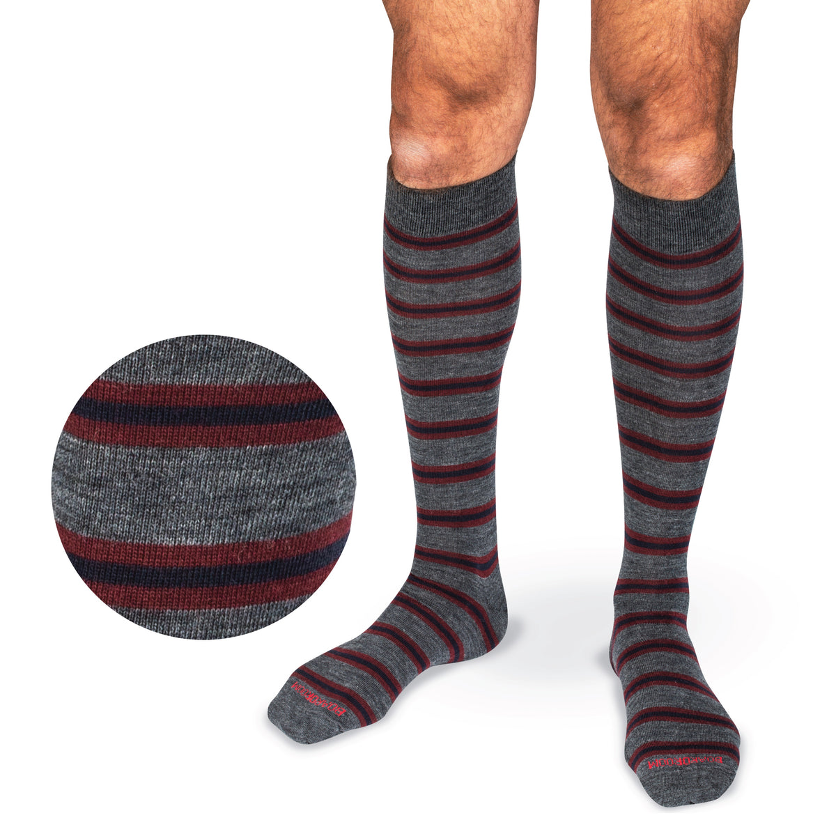 model wearing Burgundy and Navy Stripes on Grey Merino Wool Over the Calf Dress Socks on a white background