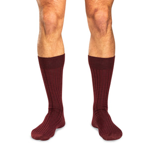 model wearing burgundy wool dress socks for men