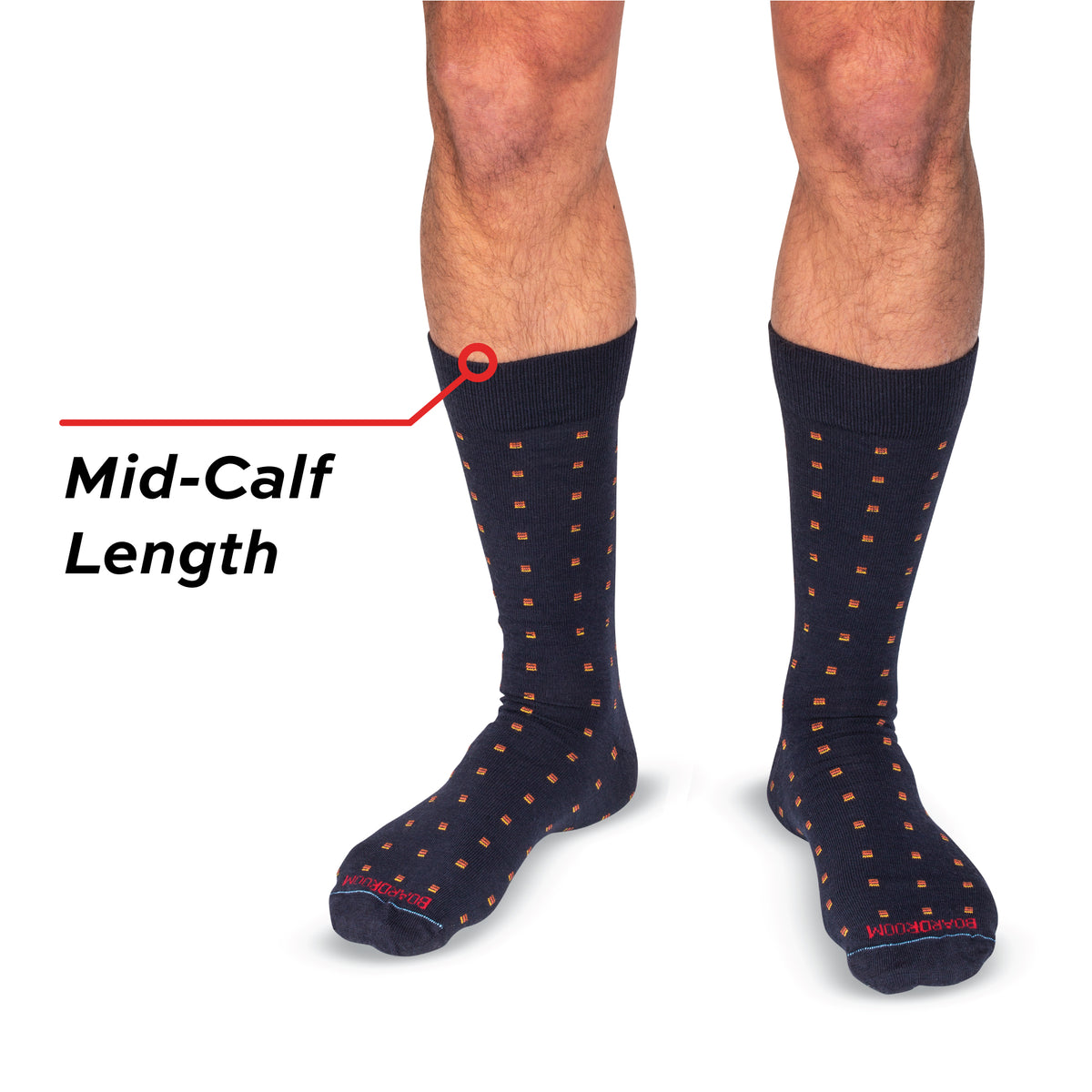 man standing wearing navy square knot patterned mens dress socks with text call out