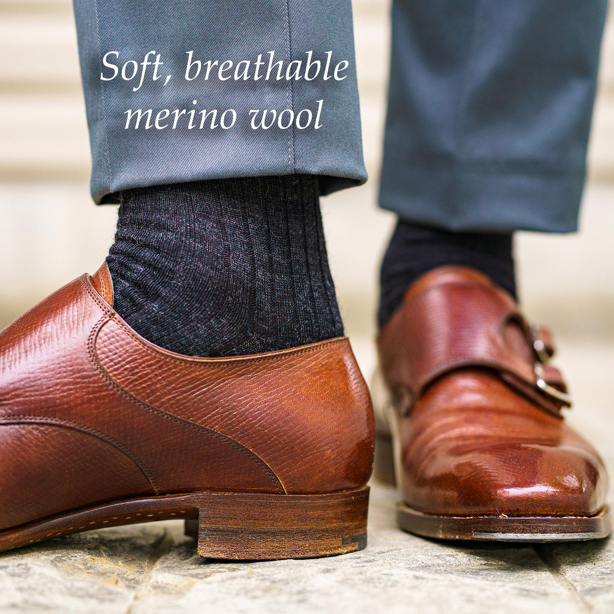 charcoal grey merino wool men&#39;s dress socks with light grey slacks and brown monkstraps