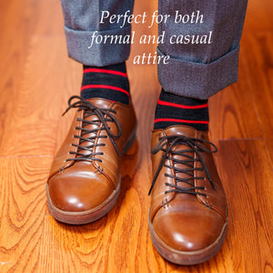 red and charcoal striped dress socks with light grey slacks and brown dress sneakers