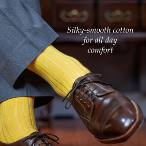 soft yellow cotton dress socks with light grey slacks and dark brown derbies