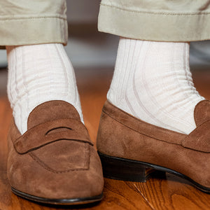 man wearing natural merino wool dress socks with light khaki chinos and light brown suede loafers