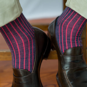 close up of coral and denim shadow striped dress socks with khaki slacks and brown penny loafers