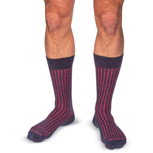 model wearing mid-calf length denim and coral shadow stripe dress socks